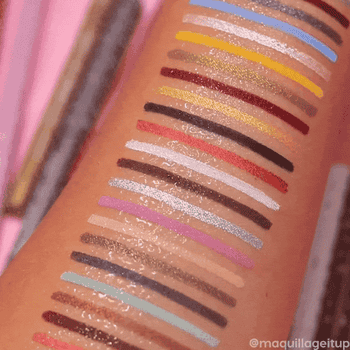 the colourpop shades on an arm and a finger swiping down them with water, showing how they don't budge