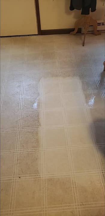 a reviewer photo of their dirty floor with one specific area being noticeably cleaner after using the sponge