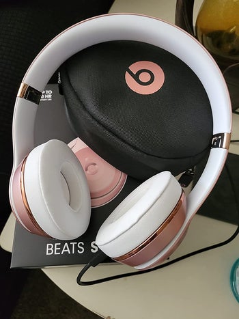 reviewer image of the rose gold headphones