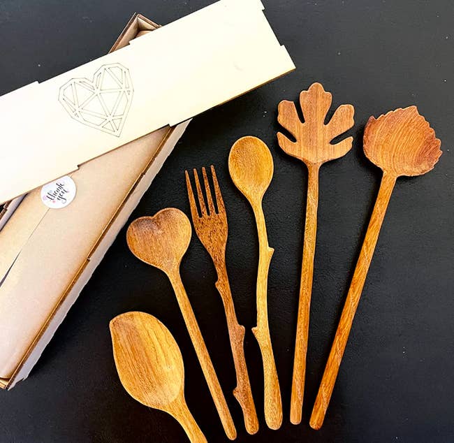 several wooden spoons beside packaging in reviewer image