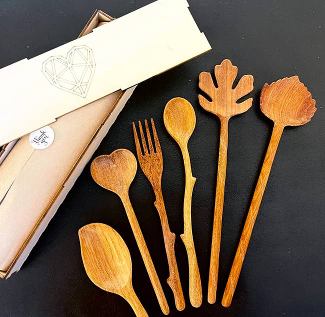 several woody spoons beside packaging successful reviewer image