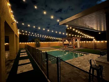 the string lights around reviewer's pool
