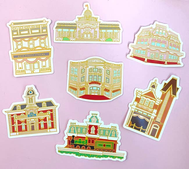 a bunch of stickers of buildings on disney world's main street