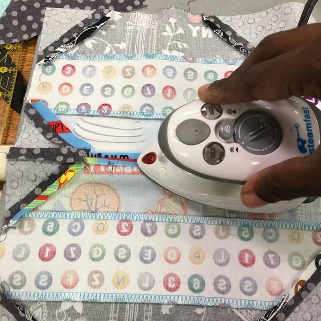A reviewer using the mini iron-on fabric