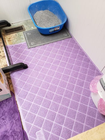 the light purple litter mat in a reviewer's litter box room
