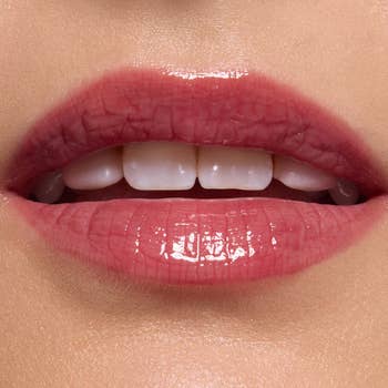 Close-up of glossy, well-groomed lips, showcasing a smooth, shiny finish