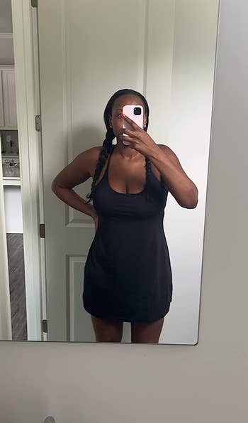 Reviewer wearing the black dress in size large