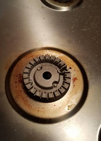 reviewer's gas range with stains