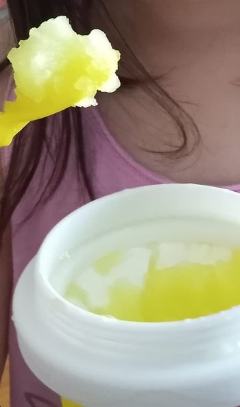 A reviewer's child with a yellow slushie