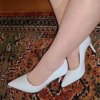 Reviewer wearing white heels