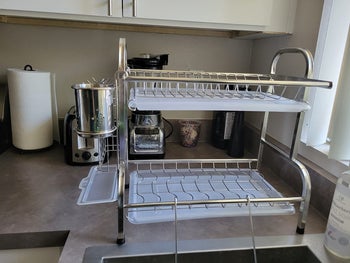 reviewer photo of empty dish rack, with steel racks and plastic board separators