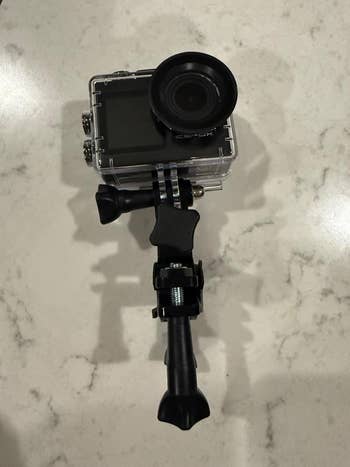 Action camera with protective casing and adjustable mount