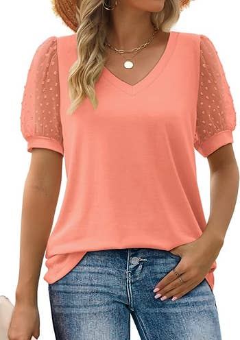 close up of model wearing the coral v-neck top