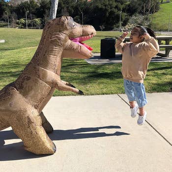 Child playing with inflatable T-Rex for scale (no pun intended)