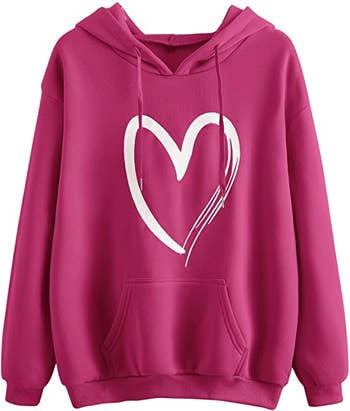 a dark pink sweatshirt with a white heart on it