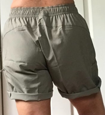 Reviewer carrying shorts from within the lend a hand of