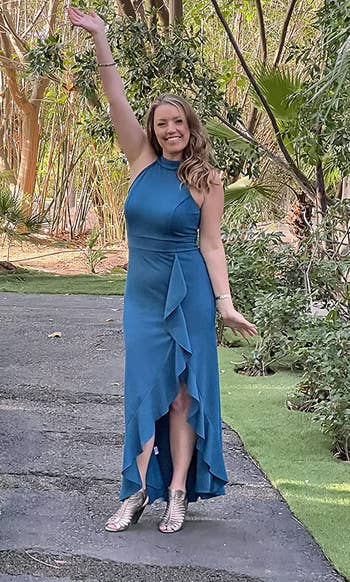 Image of reviewer wearing blue dress