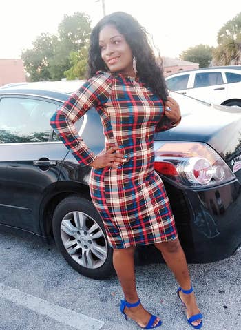 different reviewer wearing the blue, red, black, and tan plaid dress with blue heels