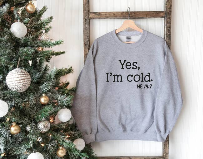 A grey sweater that says 
