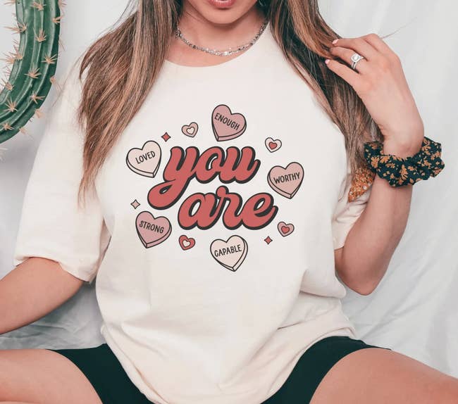A model wearing a shirt that says 