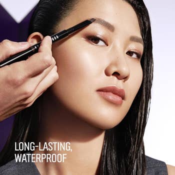 Person getting eyebrows styled with a pencil; substance reads