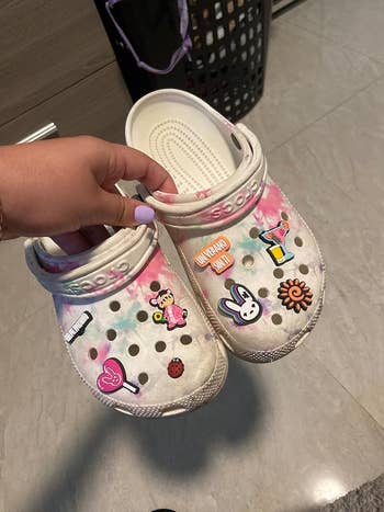 reviewers tie dye Crocs with Bad Bunny charms on them