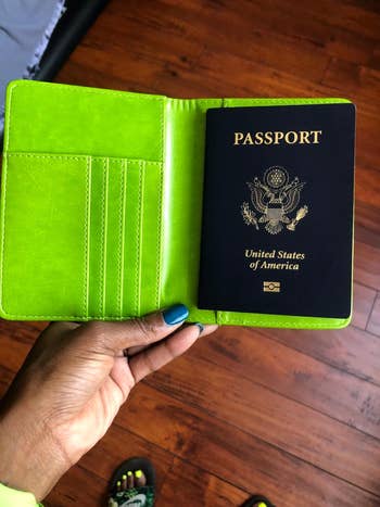 reviewer lime green holder with passport inside