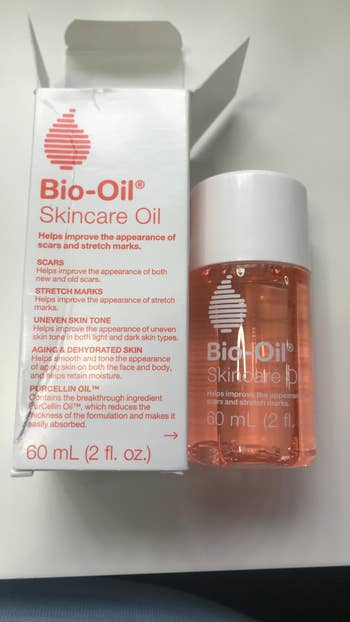 a small bottle of bio oil beside its packaging