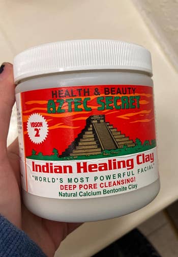 Reviewer holding their Aztec Secret healing clay