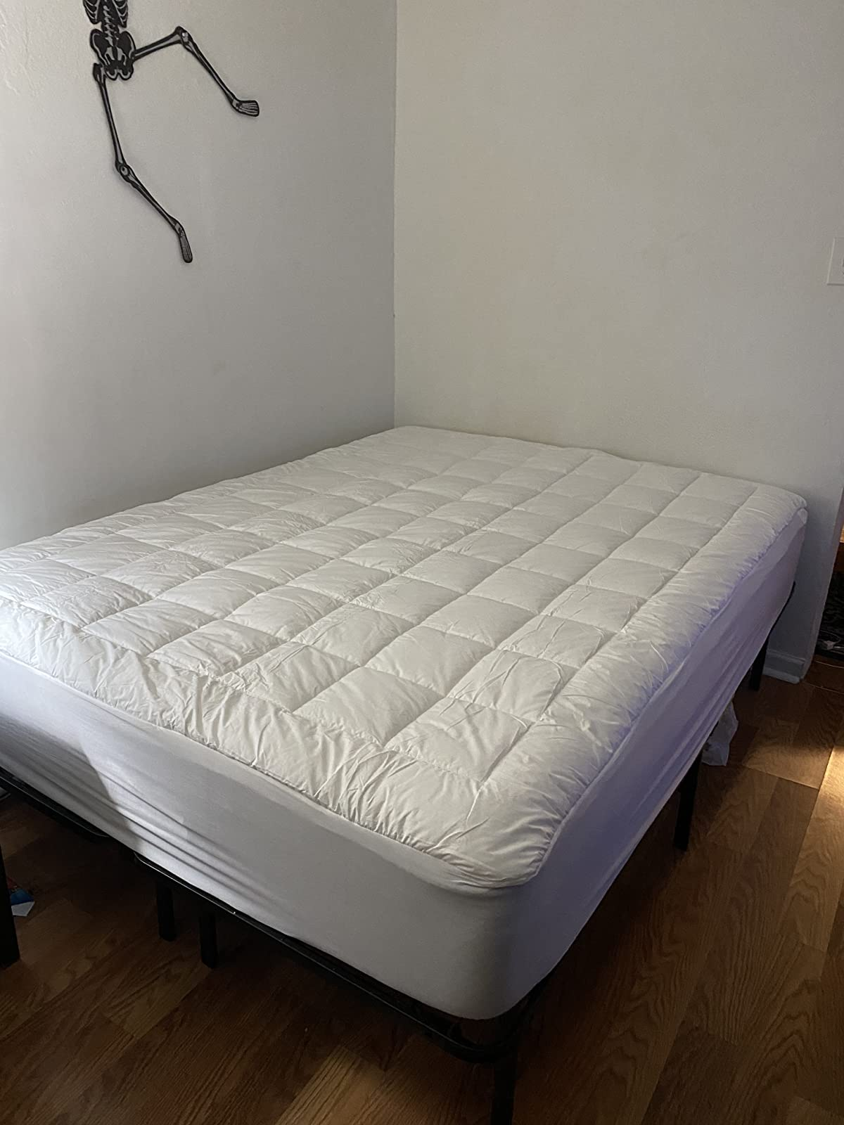 a reviewer photograph  of the mattress topper connected  a mattress 