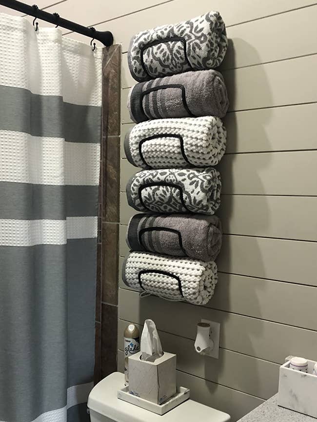 reviewer's towel rack holding six towels