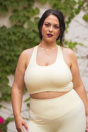 model wearing the cream bra with matching leggings
