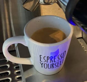 a mug filled with a drink made using the espresso machine