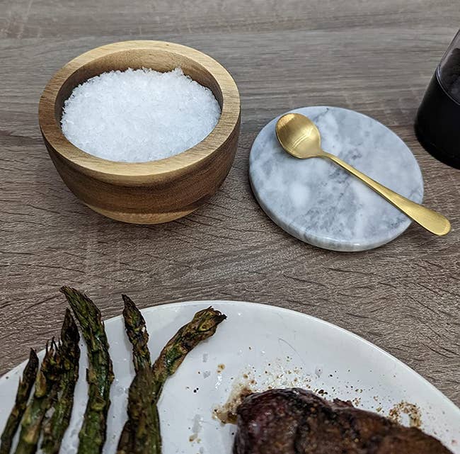 a reviewer’s salt cellar with a gold spoon