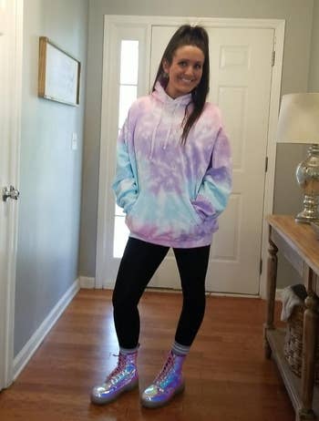 person in tie-dye hoodie and sparkling high-top sneakers