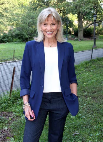 Person outdoors wearing a blazer and jeans, smiling. This representation  is featured successful  a buying  article