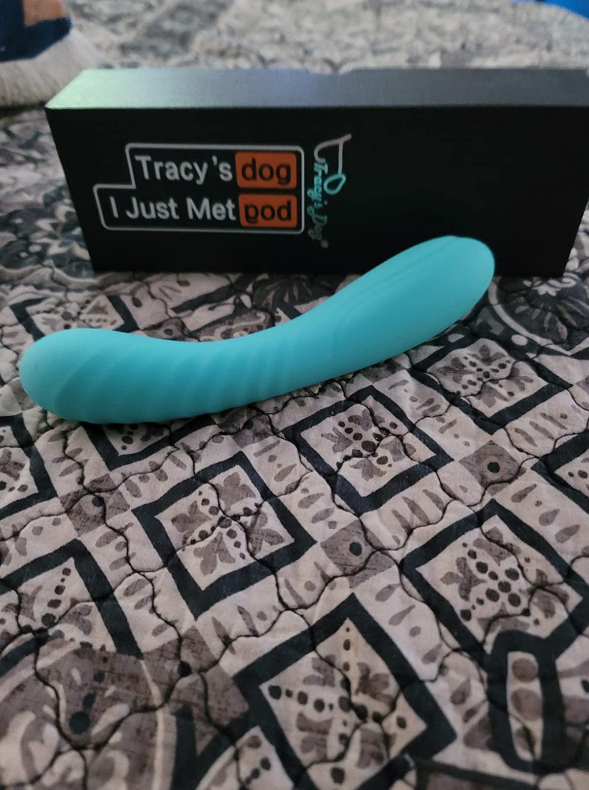 Blue textured vibrator in front of black box