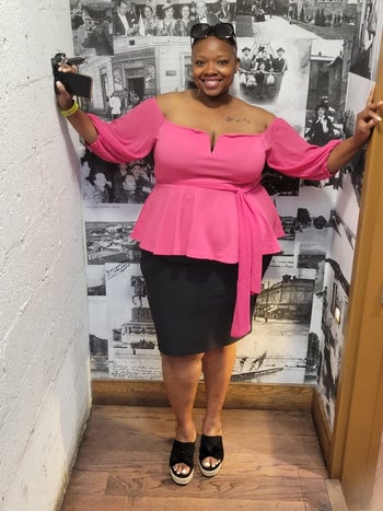 a reviewer wearing the top in pink