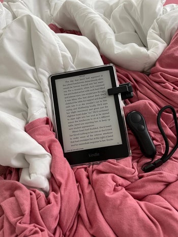 a reviewer showing the page turning in bed