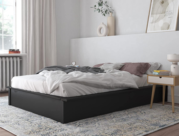 lifestyle photo of black platform bed in bedroom