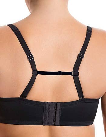 a model wearing a bra with the clip holder pulling the straps back 