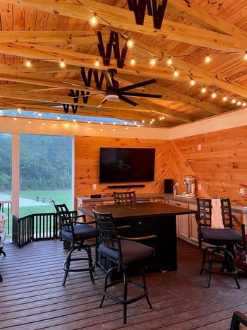 Outdoor patio with string lights hanging from ceiling