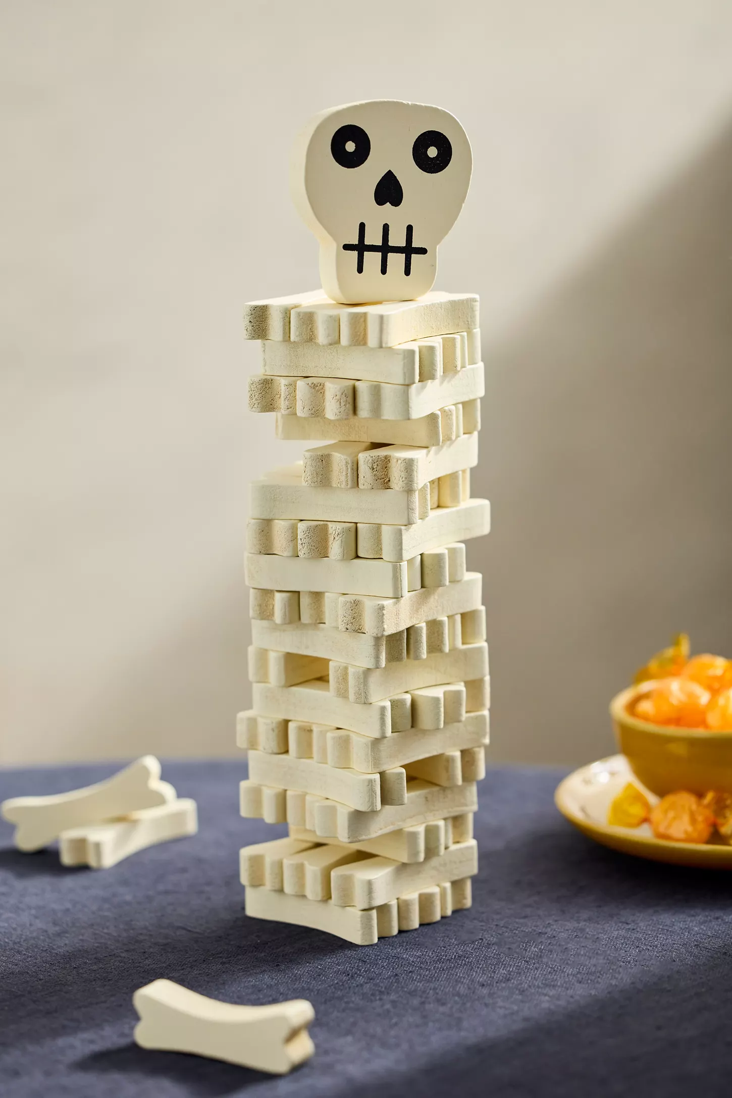 Stack of bone-shaped blocks topped with a skull figure