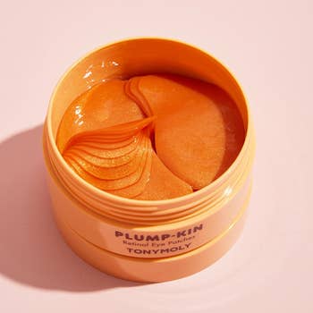Orange jar of Tonymoly Plump-Kin Retinol Eye Patches, viewed from above, showing respective  patches inside