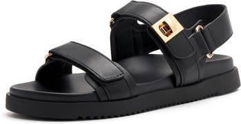 Black flat sandal with gold buckle detail 