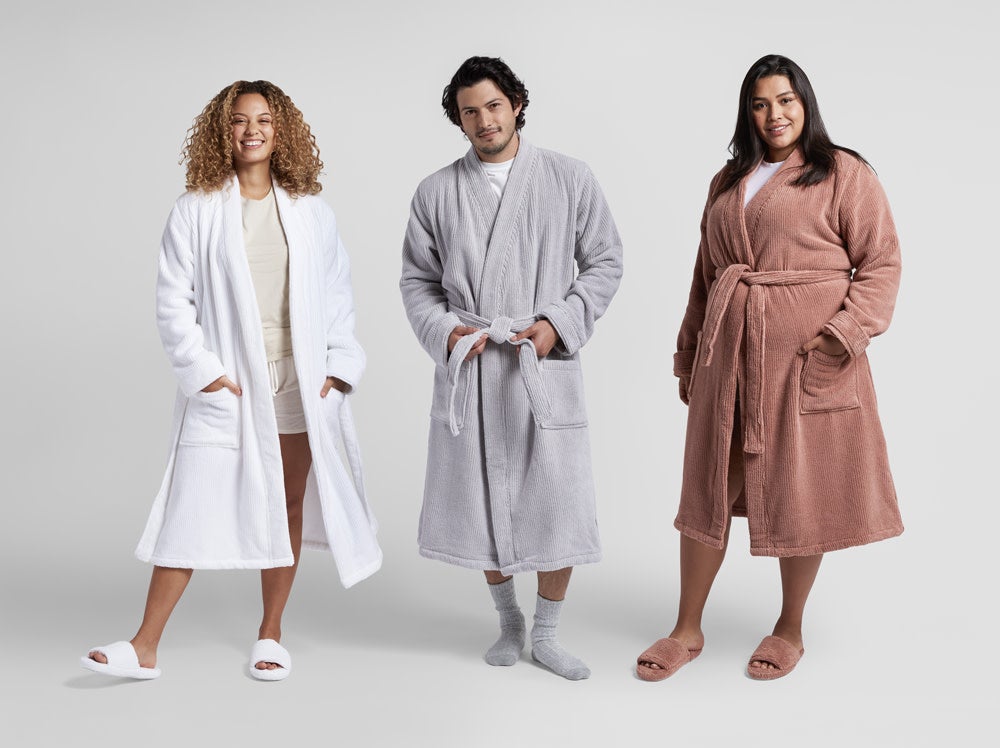 models wearing the white, gray, and pink robes