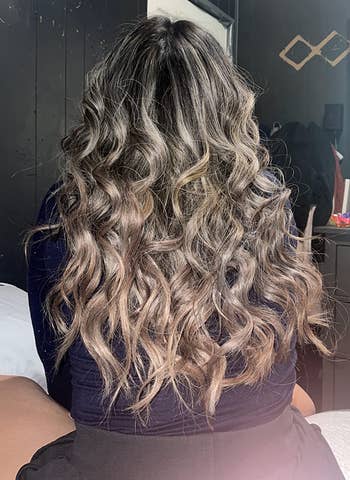 another reviewer showing off the curls flowing down her back