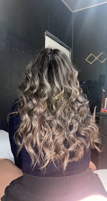 another reviewer showing off the curls flowing down her back