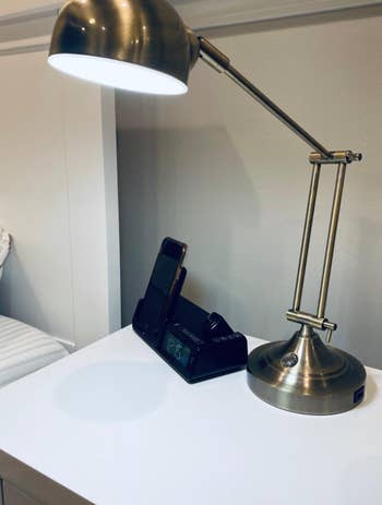 reviewer photo of a metal task lamp 

