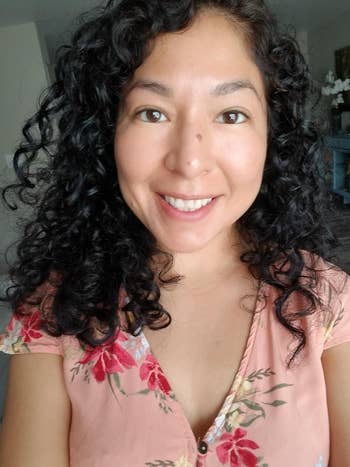 Reviewer with styled curly hair from the diffuser 